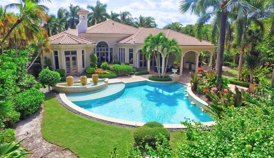 Take advantage of an opportunity to own this stunning home located in the Grand Estates of Old Palm Golf Club. Membership is optional.  This exquisite one story four bedroom, four and one-half bath home has classic elegance.  The Living Room has a gas fireplace, as well as a view of the lushly landscaped backyard and sparkling pool.  High ceilings and large windows allow sunshine to flood into this spacious  floor plan which is perfect for formal or informal entertaining.The kitchen has beautiful cabinetry and high-end appliances and opens to a spacious family room. The Den/Office located off of the foyer provides an escape for a little work or a bit of privacy, while a split floor plan allows for the luxurious Master Suite and spa-like Master Bath to be your sanctuary.