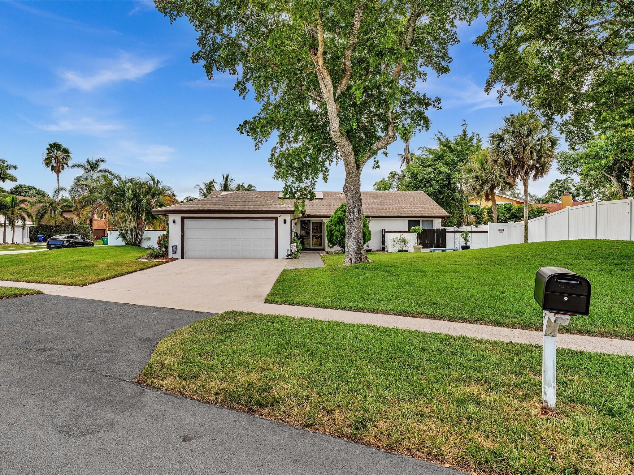 Move-in ready gem, beautifully updated for style, comfort and sustainability. Situated on an oversized corner lot, this 3/2 home blends functionality with high-end standout features including solar panels for energy savings. Inside, enjoy a bright, open-concept layout with vaulted ceilings and tile flooring. Kitchen offers newer appliances, ample cabinetry and connects seamlessly to the main living space. Bedrooms are generously sized with plenty of closet space. Enjoy fully renovated bathrooms with frameless glass, waterfall shower. Master bath boasts dual sinks, soaking tub, and separate walk-in shower. Step outside to a screened-in patio, fenced backyard, sparkling pool and covered lounge area perfect for relaxing or entertaining. Minutes from schools parks shopping and major highways