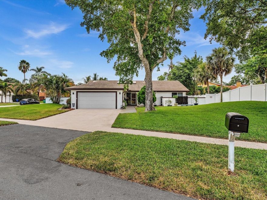 Move-in ready gem, beautifully updated for style, comfort and sustainability. Situated on an oversized corner lot, this 3/2 home blends functionality with high-end standout features including solar panels and high impact windows. Inside, enjoy a bright, open-concept layout with vaulted ceilings and tile flooring. Kitchen offers newer appliances, ample cabinetry and connects seamlessly to the main living space. Bedrooms generously sized with plenty of closet space. Enjoy fully renovated bathrooms with frameless glass, waterfall shower. Master bath boasts dual sinks, soaking tub, and separate walk-in shower. Step outside to a screened-in patio, fenced backyard, sparkling pool and covered lounge area perfect for relaxing or entertaining. Minutes from schools parks shopping and major highways