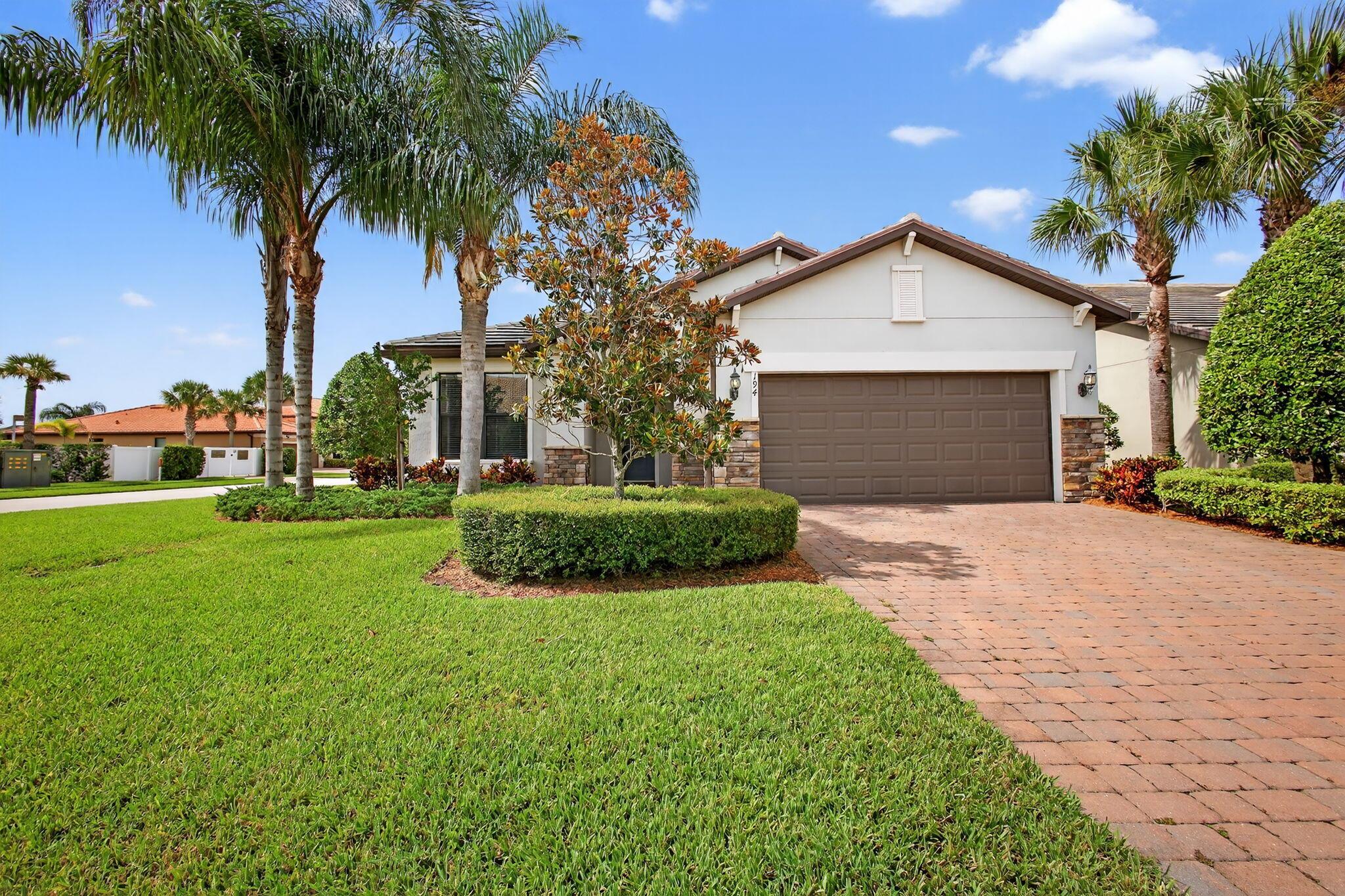 Welcome to Veranda Gardens! This beautifully maintained 3-bedroom, 2-bath home with an additional den that can function as a 4th bedroom or office Impact Glass Throughout Custom Light Fixtures & Butlers pantry,wine chiller, all in one of the most desirable gated communities in Port St Lucie Enjoy a natural gas range, newly replaced water heater (2025) Step into an open-concept floorplan with plenty of natural light, a spacious kitchen with quartz countertops, and a large island perfect for entertaining. The primary suite features a enormous walk-in closet, dual vanities, and a walk-in shower. Relax on the extended screened lanai, Community Features:Resort-Style Pool & SpaState-of-the-Art Fitn