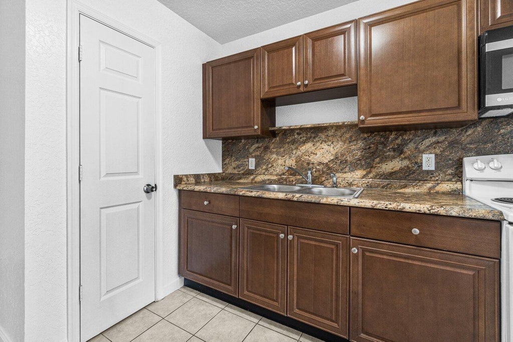 Photo of 751 Hummingbird Way #1, North Palm Beach, FL 33408 (MLS # B26037438)