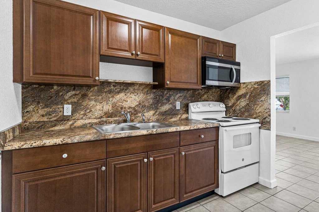 Photo of 751 Hummingbird Way #1, North Palm Beach, FL 33408 (MLS # B26037438)