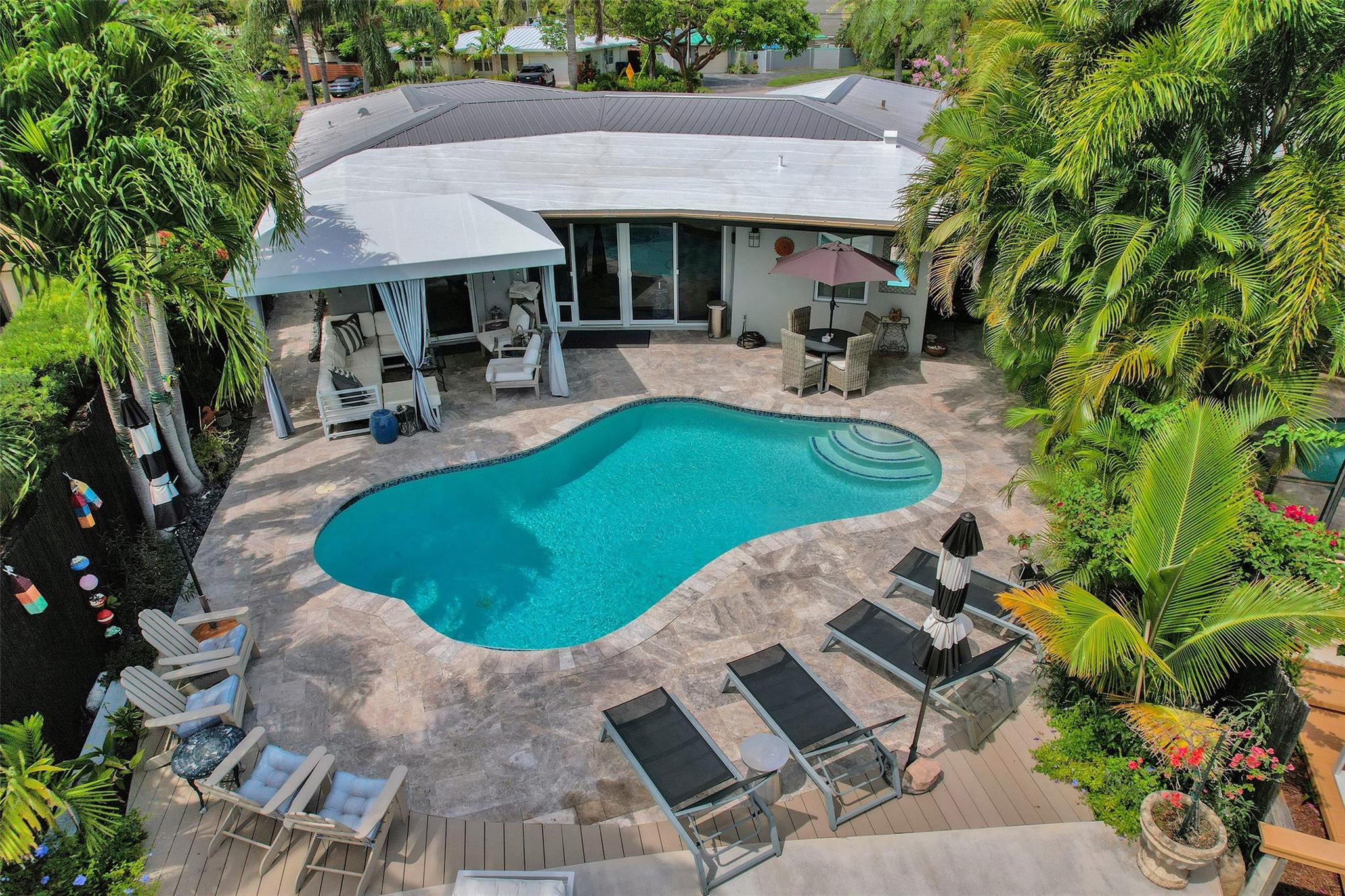 Absolutely Stunning Waterfront Home in East Wilton Manors!
This rare gem in one of Wilton Manors’ top neighborhoods offers gorgeous interiors perfect for entertaining and incredible outdoor living with long water views. Open concept interior living, Upgrades include designer bathrooms, quartz countertops, custom kitchen cabinetry, new stainless-steel appliances, LED lighting, impact windows and doors, a brand-new dock and raised seawall, plus a versatile bonus room from a garage conversion, or keep as a garage. Brand nee AC July 2025. This extra-large corner lot is very well maintained and landscaped. A true lifestyle home—don’t miss this one!