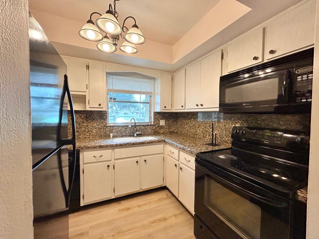 Photo of 2854 E Ashley Dr Drive E #B, West Palm Beach, FL 33415 (MLS # B26035658)
