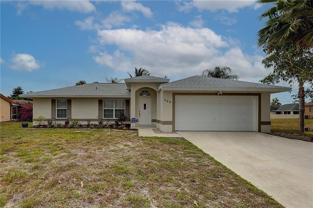 Photo of 326 SW Covington Rd, Port Saint Lucie, FL 34953 (MLS # F10326685)