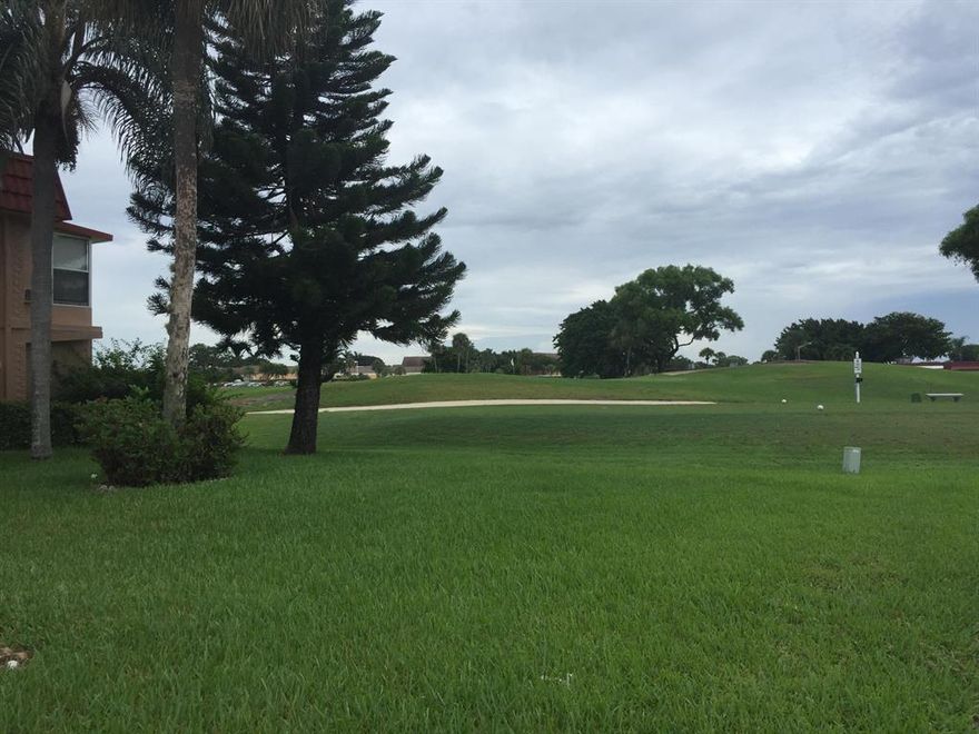 First floor on golf course! View from living room.  True corner with parking spot just a few feet from unit.Very private with fantastic view of course from living room.  Enclosed patio for that bonus room with real glass windows. Xtra closet in den/2nd bedroom & xtra closet on porch.  Hurricane drop downs Tile thru out on diag. Kitchen and baths have been updated.  Must see - this is a resort style community -3 multi-million dollar clubhouses, tennis courts, indoor/outdoor swimming pools (all heated) indoor resistance pool and lap pool. Walk in shower in both bathrooms. Theatre with live entertainment weekly, free movies, arts/crafts, beauty shop, Bistro, cafe all on site. Courtesy bus daily to shopping. 6 miles from the beach and historic downtown Delray.
