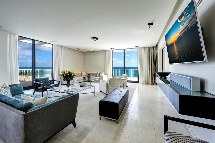 Discover the epitome of seaside luxury in this direct oceanfront corner penthouse, where exceptional living meets modern elegance. With 3 spacious bedrooms and 3 thoughtfully designed baths, this residence showcases an impressive 10-foot ceiling height, creating an airy ambiance that seamlessly blends comfort with sophistication. Five floor-to-ceiling sliders invite natural light to flood in, showcasing the magnificent ocean views. Step outside onto a sprawling 1,450+/- SF wrap-around terrace, your private sanctuary adorned with breathtaking, unobstructed views of the Atlantic Ocean. Imagine morning sunrises and evening sunsets as your daily backdrop, where every moment feels like a vacation. The iconic 400 Building, a town landmark designed by the renowned architect Edward Durell Stone,