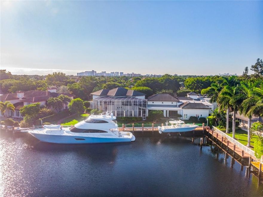 Gated & secured Bay Colony estate! This spectacular home encompasses +/- 12,000 sq. feet of living space. 5 min from intracoastal waterway. 183' of protected DEEP WATER dockage, Nautilus electric boat lift, newer concrete dock, NEW full home hospital generator(150 kw) and backup generator(85 kw). High ceilings throughout. Ground floor master w/ His & Her baths/huge closets. Remodeled kitchen w/ Viking range and Wolf double wall ovens & warmer, Sub Zero refrigeration. 5 car garage, private staff quarters w/ separate entrance, 2 offices, home theater, custom pool w/ NEW full screen enclosure, large attic & storage room, and beautiful landscaping! Continual upgrades & improvements will impress with this 1st class listing! This unique offering is pristine in every way & a pleasure to show!