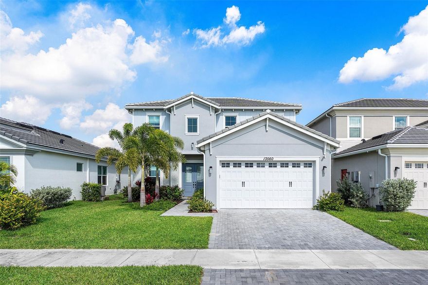 Why wait to build when you can purchase this TURNKEY Beautiful home featuring 4Beds, 3Baths plus a Den/Office with Tasteful upgrades you would be proud to walk in to daily! Experience the pinnacle of Florida living in this perfectly oriented home with both a Lake in the front & back. Welcoming you with golden afternoon light & curb appeal that radiates warmth. Inside, modern luxury meets thoughtful design featuring all the bells & whistles, BUT the true magic happens at the rear. Positioned on a premium lot, the home offers a serene backyard where you can enjoy tranquil sunrises over the glistening Lake. Whether you're hosting sunset dinners in the Lanai or savoring quiet lakeside mornings, this property offers a rare balance of light & luxury in Palm Beach County’s most vibrant community. Upgrades:- Impact windows- Whole house water filtration system and water softener - wood tile flooring downstairs- Quartz counter tops in kitchen- Dual shower head in master bath - Frameless shower - Quartz counter in master bath and downstairs bath- LVP on stairs- Upgraded stair railings - Backsplash- Pantry pull out drawers- Barn door to den- Recessed lighting in kitchen, family room, and master bedroom - Fenced in backyard - Extended patio - Epoxy garage- Overhead storage in garage - 210 v outlet in garage-City on own Power Grid and will never lose power during a storn for longer than a few minutes if at all