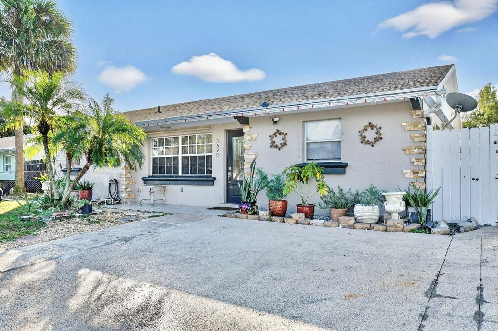 Photo of 5590 S 35th Court, Greenacres, FL 33463 (MLS # F10544953)