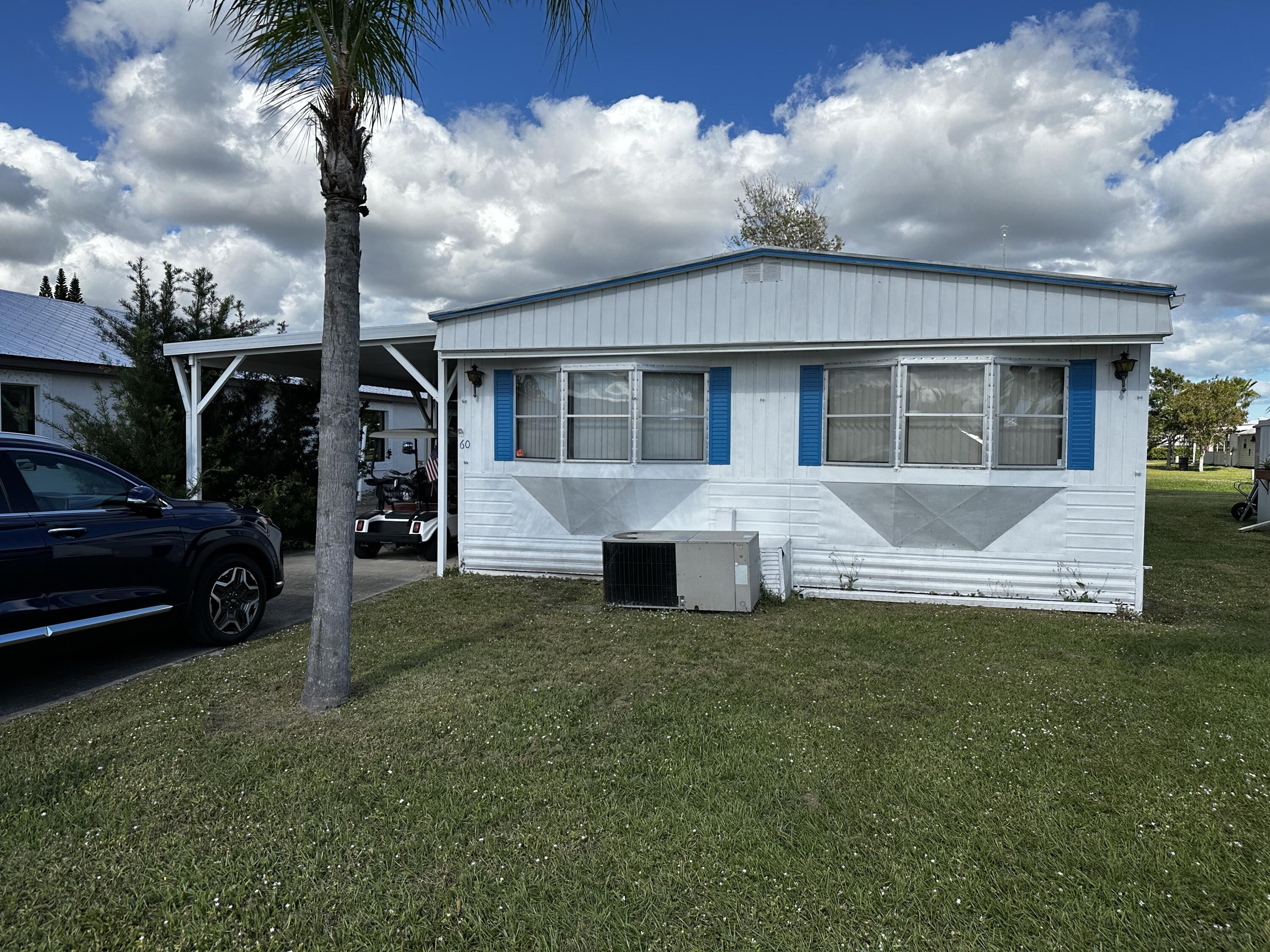 The Florida lifestyle in a furnished home, with a large sunroom overlooking a peaceful canal.This home offers 2 bedrooms, 2 bathrooms, screened front patio, canal side patio and a large shed with washer & dryer. Spanish Lakes is a 55+ Community that offers the Florida lifestyle with amenities such as clubhouse, golf, socials, tennis, shuffleboard, pool, gym, and so much more. The HOA/Land Lease is to be $666.56 monthly, including your lawn maintenance, trash removal, property taxes and community activities. The community is close to the beaches, hospitals, restaurants and shopping.