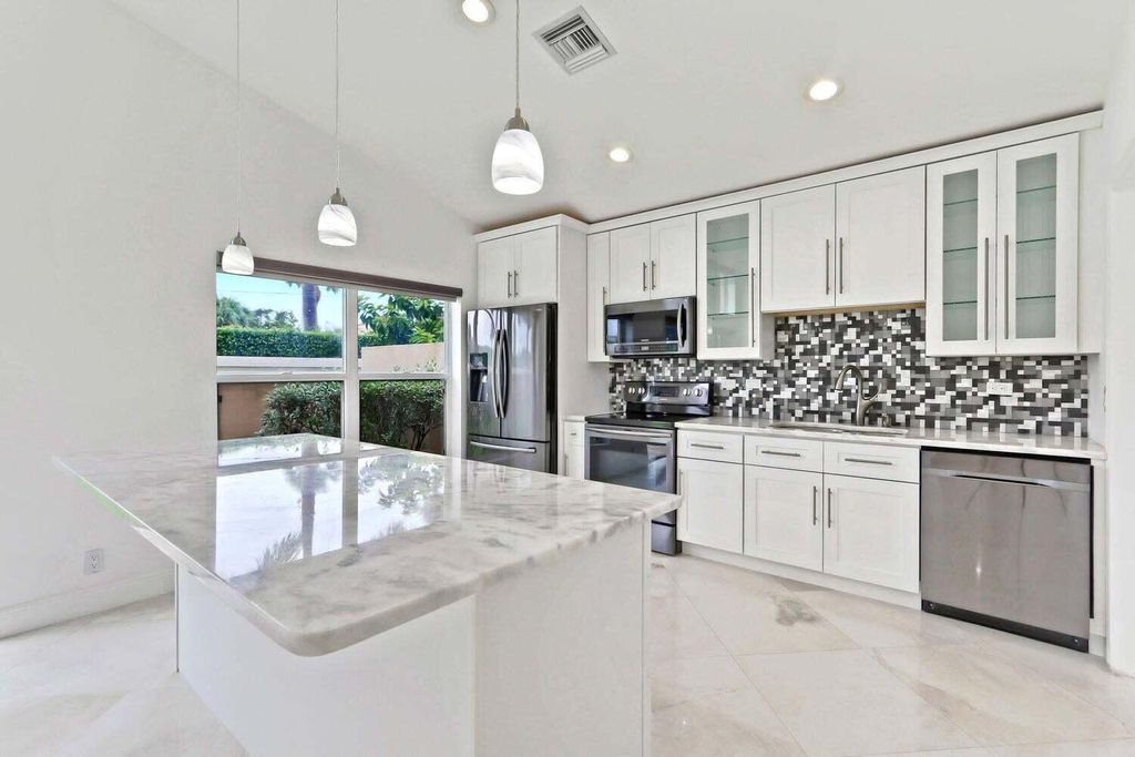 Photo of 8265 Palm Gate Drive, Boynton Beach, FL 33436 (MLS # R11135330)