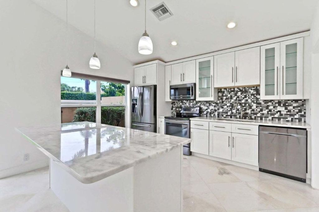 Photo of 8265 Palm Gate Drive, Boynton Beach, FL 33436 (MLS # R11135330)