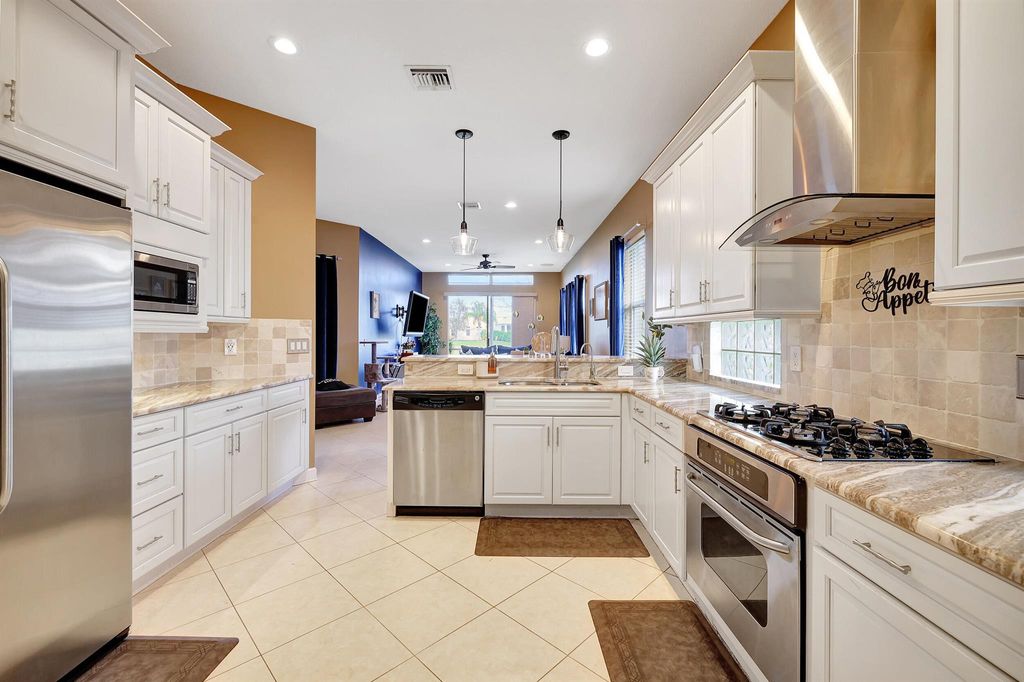 Photo of 104 NW Willow Grove Avenue, Port Saint Lucie, FL 34986 (MLS # R10959739)