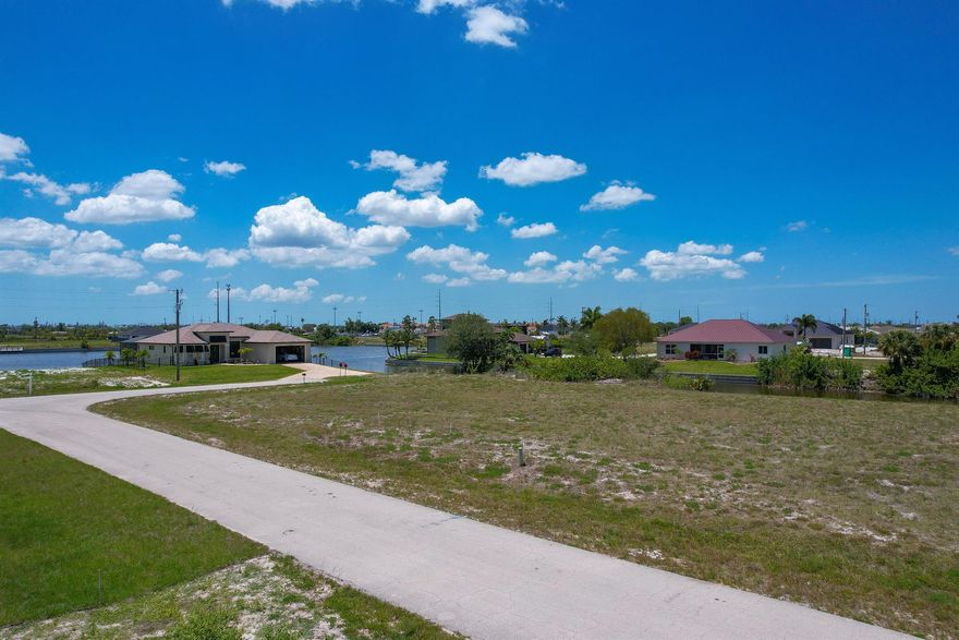 A splendid fresh water canal lot where you can construct your dream home, nestled among newer residences. Property has a newer concrete sea wall. This property offers convenient access to schools, shops, and dining options, with public utilities, including water and sewer, readilyavailable. Located on a serene canal, the lot is ideally positioned near the crossroads of Tropicana Parkway and Nelson Road North in the rapidly expanding area of Northwest Cape Coral, surrounded by new construction. Cape Coral, one of the fastest-growing cities in the United States, presents a remarkable chance to own a slice of paradise.