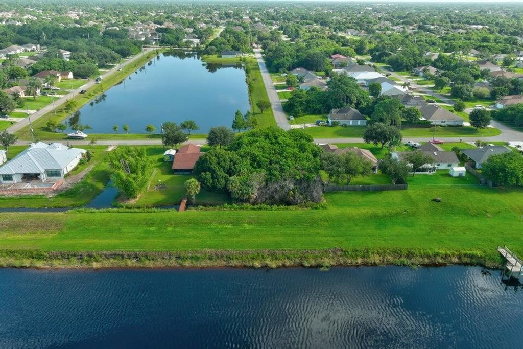 Photo of 990 SW Abbot Avenue, Port Saint Lucie, FL 34953 (MLS # R10981896)