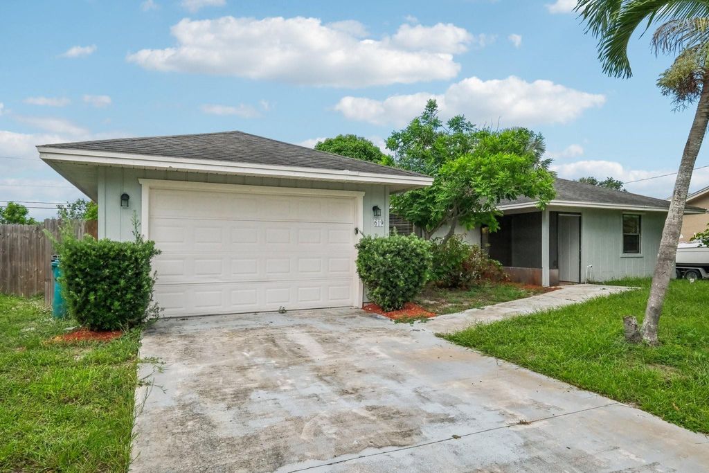 Photo of 619 SE Crescent Avenue, Port Saint Lucie, FL 34984 (MLS # F10483609)