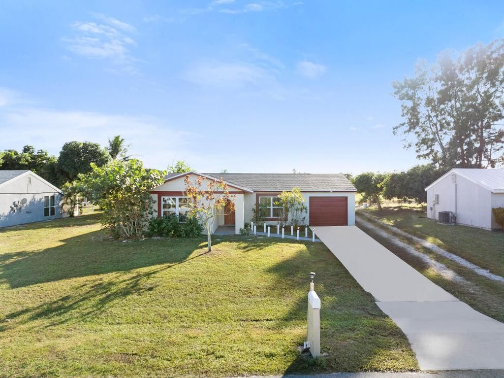 Photo of 244 SW Cherryhill Road, Port Saint Lucie, FL 34953 (MLS # R11144865)