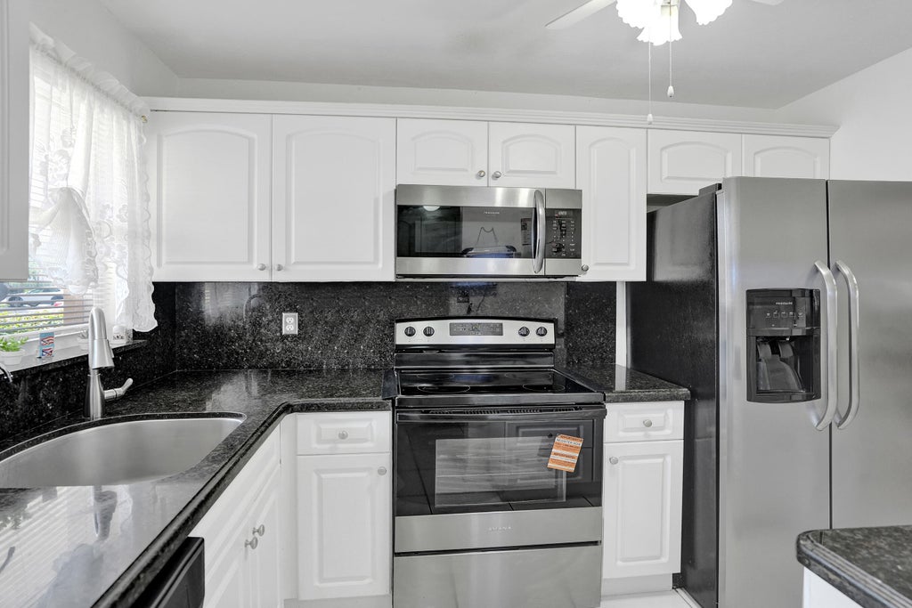 Photo of 2651 Sunrise Lakes Drive E #104, Sunrise, FL 33322 (MLS # B26069949)