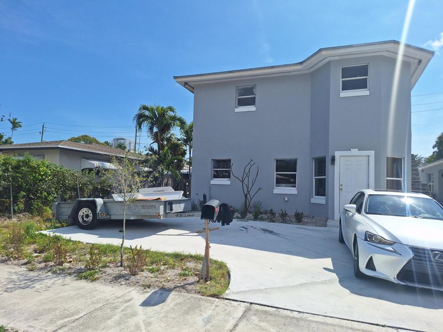 This listing features 3 separate buildings, offering an exceptional multi-family investment opportunity in one of Hollywood's most sought-after areas.  The first building is a duplex with two spacious units: a 3-bedroom, 2-bath unit and a 2-bedroom, 1-bath unit. The second is a standalone unit with flexible development potential, ideal for conversion into a one-bedroom or studio. The third is an unfinished fourplex featuring four 2-bedroom/1-bath units, currently in the late stages of development and pending a certificate of occupancy.  Don't miss this fantastic opportunity to own a multi-family property in one of the best areas of Hollywood.
