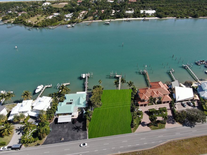 (ZONING: R3A, FUTURE LANDUSE: COM/OFF/RES)If you are considering building in the Jupiter-Tequesta area on deep blue water within minutes to the Jupiter Inlet with beautiful views and no fixed bridges, this is a must see. The dock is new including composite decking and two boat lifts, one 60,000 lb. capacity and one 20,000 lb. capacity. The current house is considered a tear-down.