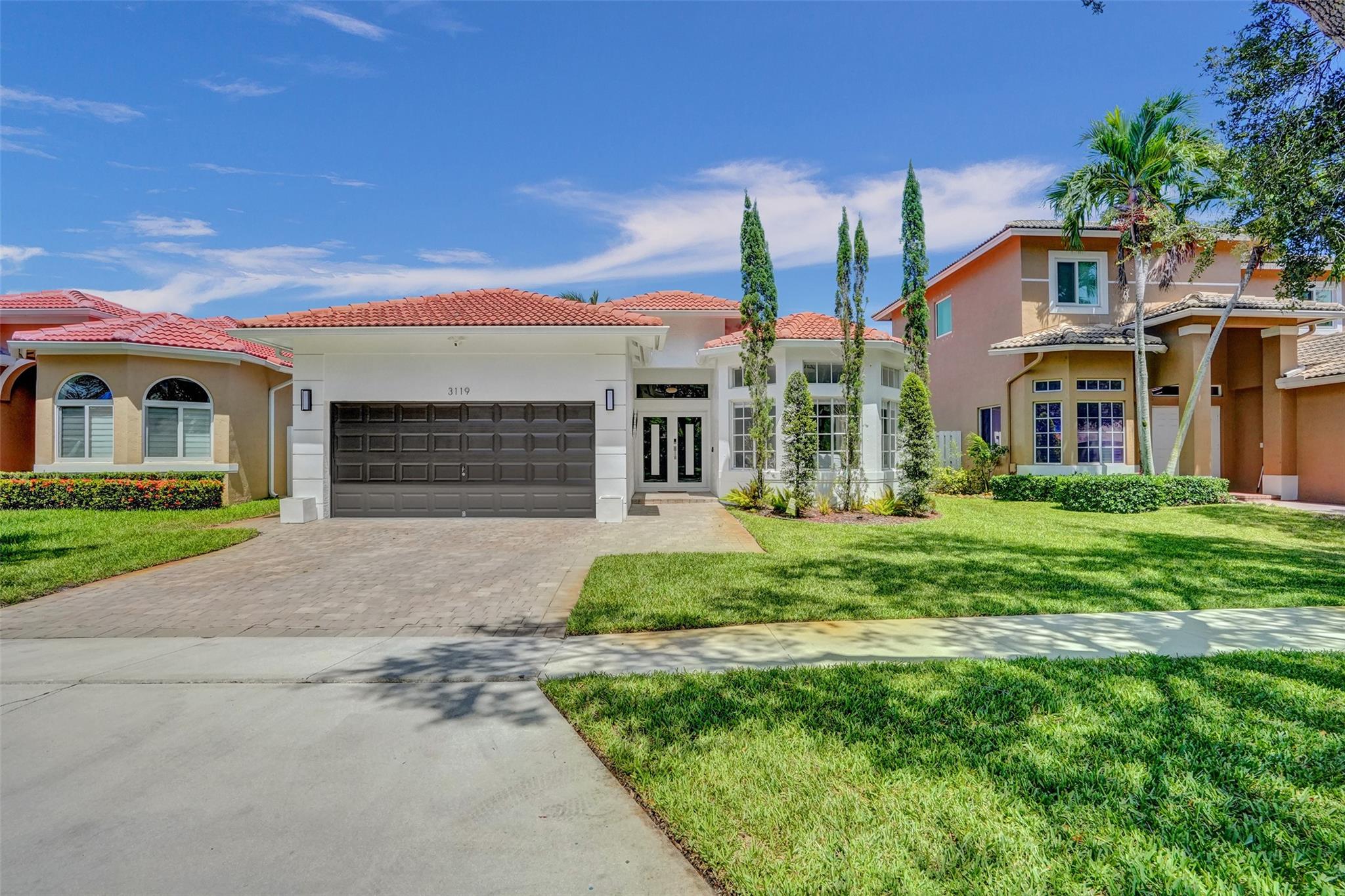 Welcome to this beautifully updated home in a desirable gated community, offering modern finishes and thoughtful upgrades throughout. Step inside to find sleek porcelain floors and a stunning master bathroom featuring a freestanding tub. Enjoy custom California closets, a tempered glass linen closet door, and elegant baseboards, moldings, and interior doors. The chef’s kitchen shines with all-new appliances, while the polished concrete garage floor, ceiling storage racks, and hurricane impact front door with overhead transom add both style and functionality. Outdoor living is a dream with a travertine patio deck, lush landscaping with lighting, rain gutters, and a freshly painted exterior. The redone driveway completes this move-in-ready home designed for both luxury and peace of mind.