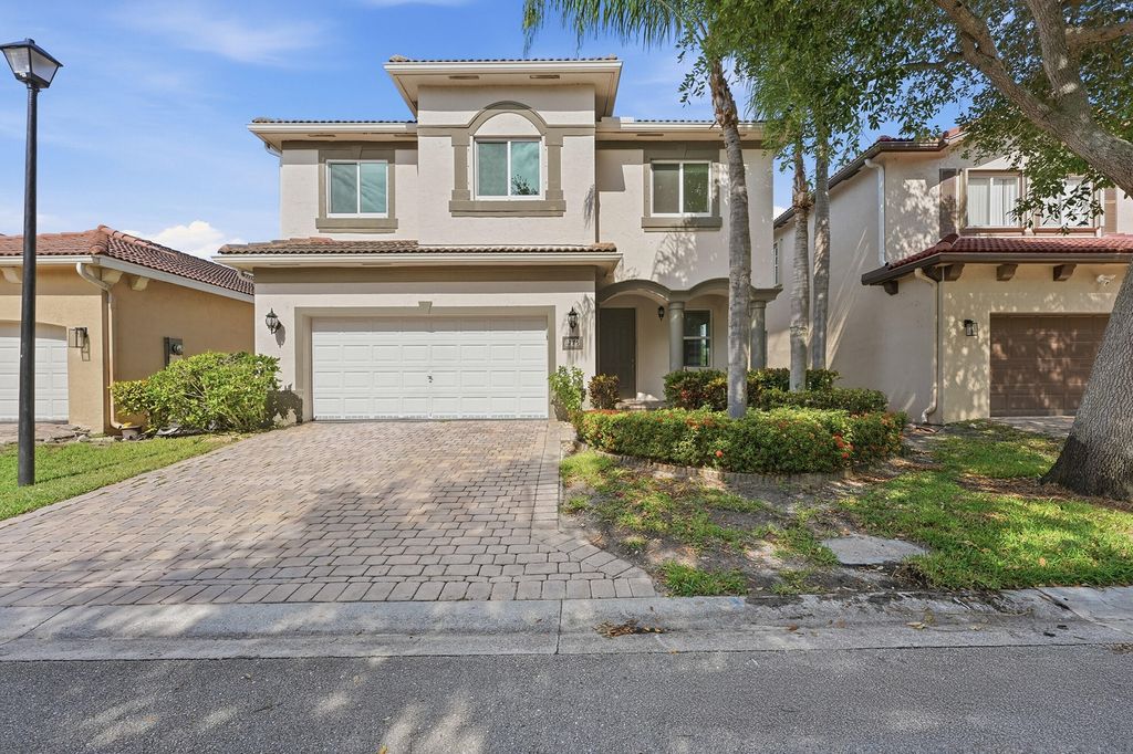 Photo of 1275 Rosegate Boulevard, Riviera Beach, FL 33404 (MLS # B26021433)