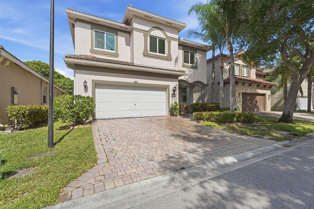 Photo of 1275 Rosegate Boulevard, Riviera Beach, FL 33404 (MLS # B26021433)