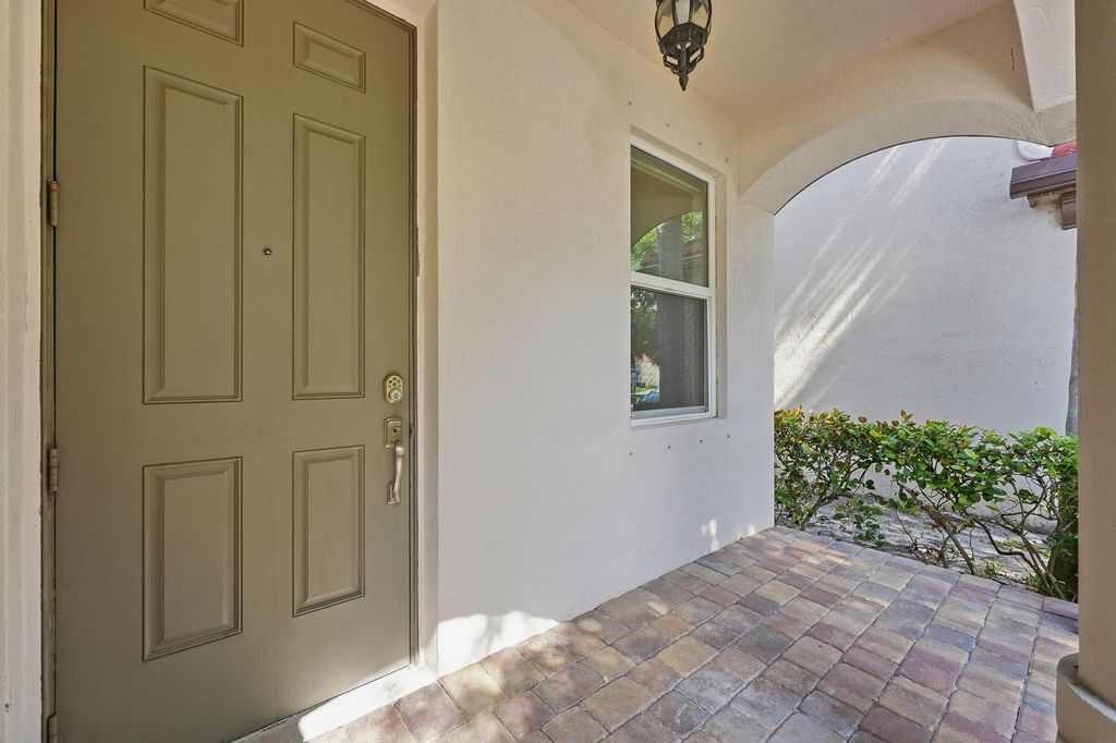 Photo of 1275 Rosegate Boulevard, Riviera Beach, FL 33404 (MLS # B26021433)