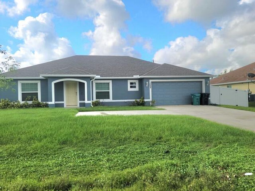 Photo of 1068 SW California Boulevard, Port Saint Lucie, FL 34953 (MLS # R11153751)