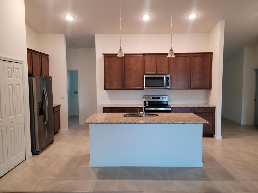 Photo of 1068 SW California Boulevard, Port Saint Lucie, FL 34953 (MLS # R11153751)