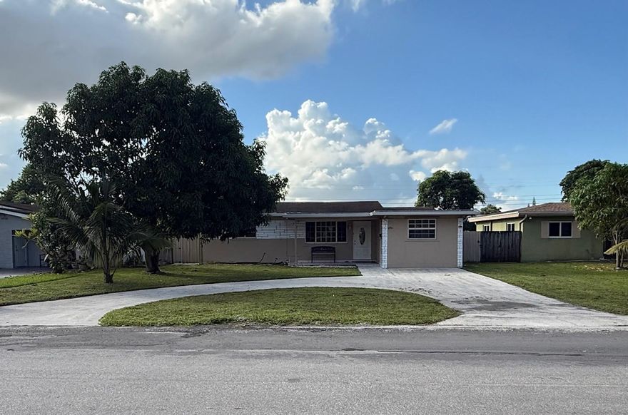 -Beautiful Spacious 4 bedroom & 2 baths (Tax roll record shows 2/1) located in nice quiet neighborhood in Pembroke Pines, Wood kitchen with granite countertop. A/C installed in 2024, Roof installed 2017, all tiles thorough out the house NO CARPET, circular driveway Fruit trees. Convenience location close to everything. This is perfect for your family. MUST SEE don't miss this opportunity.