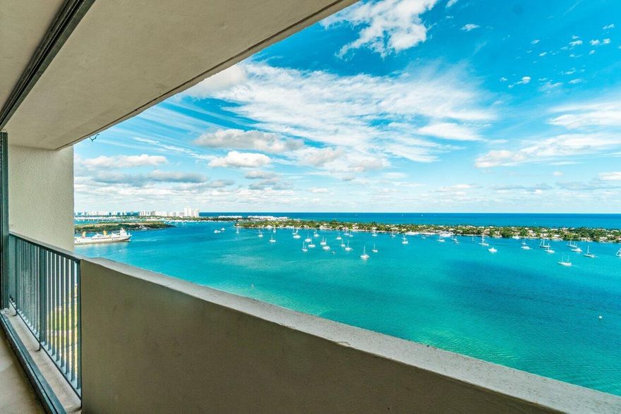 Easy to see! BREATHTAKING, direct ocean + intracoastal views in this east facing Penthouse at the Palm Beach House. Feel like you're on vacation every day in this 2 bedroom ( king, queen, single, sleeper couch) , 2 bathrooms (Jacuzzi tub) furnished condo w/ 1 assigned covered parking space near the elevator. Washer/Dryer in unit. This is the only building w/ a sandy beach, pier for fishing, billiards room + tiki hut for afternoon relaxing. Centrally located, you're minutes to dining + supermarkets on Palm Beach, Downtown West Palm Beach and Northwood Village. You're also close to Phil Foster park for world class shore diving and golf courses. All you need is your suitcase + toothbrush + you can call this gorgeous condo ''HOME' ''make sure to wave good morning to sly''