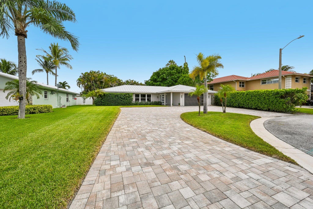 Photo of 2610 Sun Cove Lane, North Palm Beach, FL 33408 (MLS # B26073628)
