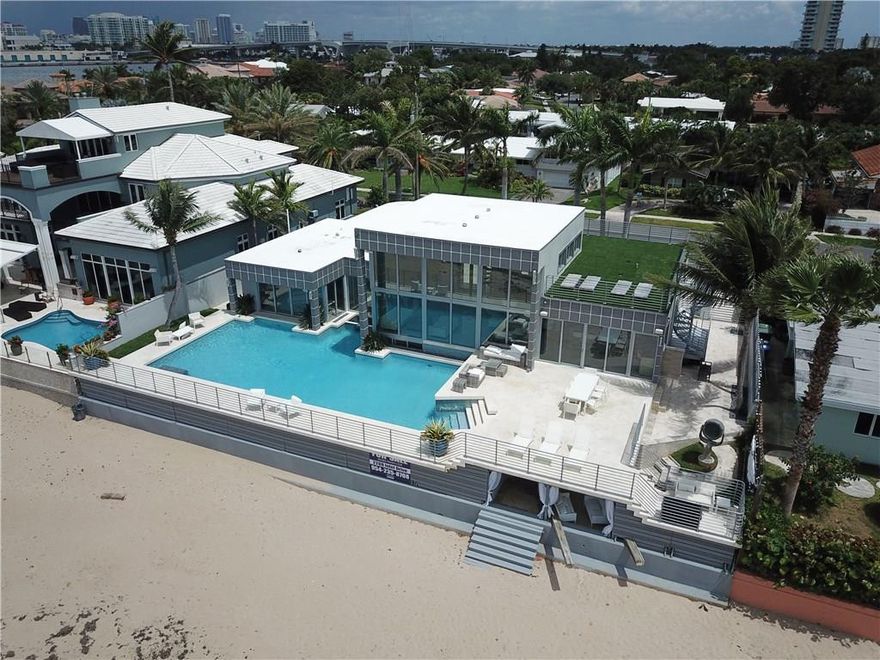 ONCE IN A LIFETIME OPPORTUNITY to reside in one of only 10 exclusive Estates along the channel at Port Everglades! Magnificent Ocean & Intracoastal views w/ an endless parade of boats, cruise ships, & marine activity seen thru walls of glass, beach, from the massive resort style pool & deck, or from the rooftop! Interior features top of the line designer finishes & every conceivable luxury appt. (Control 4, automated shades, A/V/security, A/C garage, etc.) Exterior shows like a movie set! It must be seen!