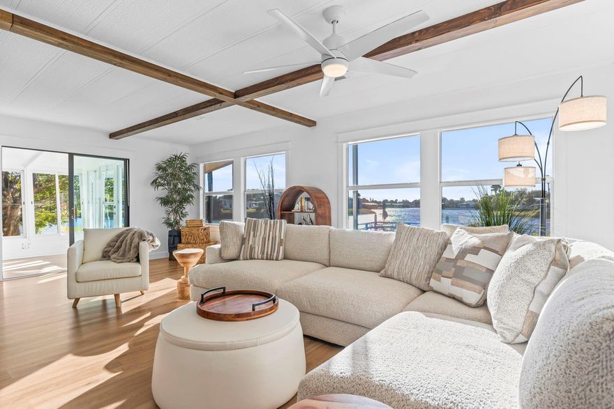 HGTV style FULLY REMODLED custom designed home just like new! Up to $10,000 buyer closing credit! Your amazing turn-key home comes fully furnished with everything included-road licensed Golf Cart as well!  As you enter your inviting humble and tranquil Florida Room you will not want to leave the relaxing space. Easily convert into an additional room for welcomed guest or a peaceful office space with breathtaking views. Chef inspired kitchen with quality Quartz counters, high-end energy efficient appliances and an expansive center island perfect for gathering or enjoying a morning brew catching bright sunrays. Lavish living room perfect for entertaining, inviting dining room, additional bonus Florida room, expansive bedrooms with an ensuite bathroom and custom vanity. MOTIVATED SELLER!!!