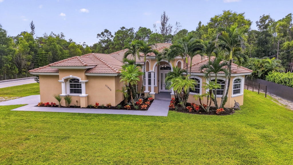 Photo of 11030 56th Place N, The Acreage, FL 33411 (MLS # B26082784)