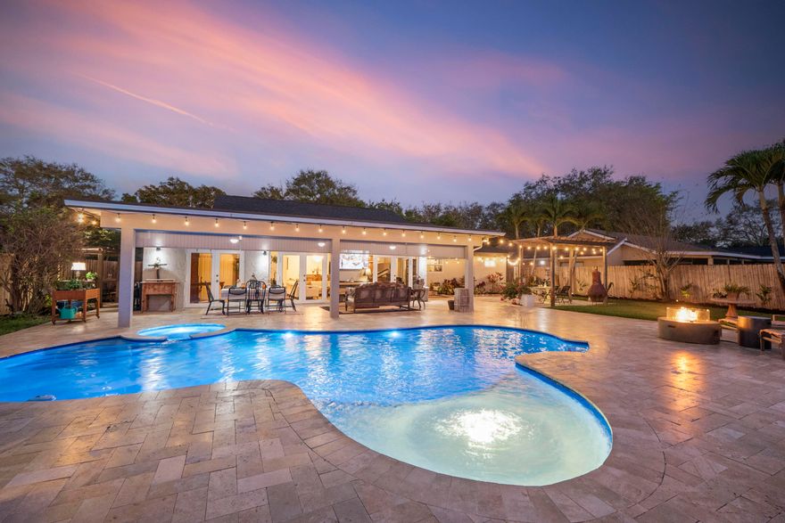 Beautiful 4 bedroom, 2 bathroom home on a quiet cul de sac in the desirable Rock Creek community of Cooper City. Split floor plan with spacious open living area overlooking an oversized, private backyard with stunning pool & sunset views. Enjoy a backyard oasis featuring a fully refinished pool & sun deck with bubbler, color changing lights & travertine pavers. The yard also includes two pergolas, a storage shed & covered patio with insulated tongue and groove ceiling & Bahama Breeze fans. Interior highlights include engineered vinyl flooring, recessed lighting & updated kitchen with quartz countertops & modern cabinetry. Additional upgrades include a 2024 roof, tankless water heater, newer AC, impact windows & doors, 2 car garage, oversized driveway, well water sprinkler system & low HOA!