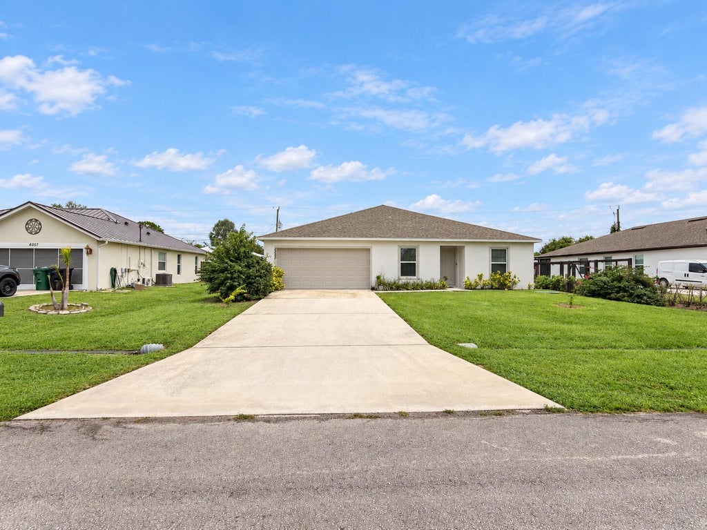 Photo of 4065 SW Hablow Street, Port Saint Lucie, FL 34953 (MLS # B26078374)