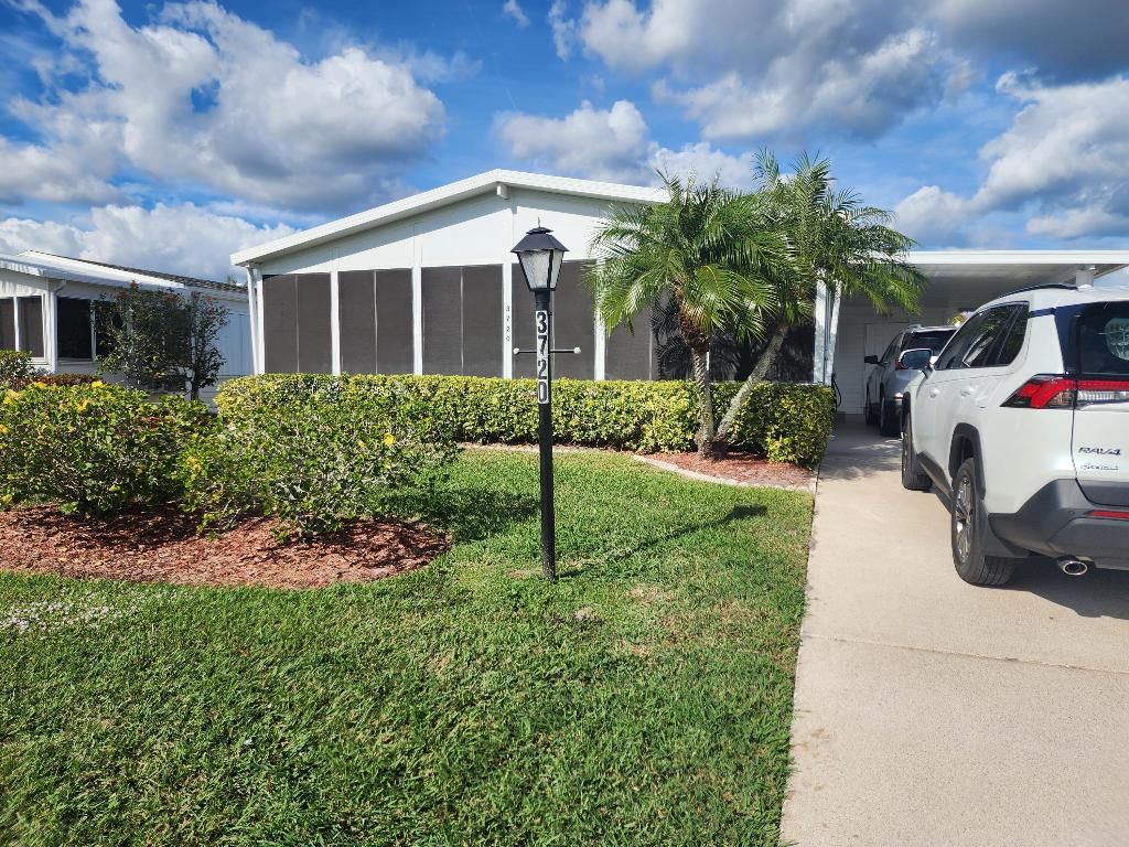 Photo of 3720 Crabapple Drive, Port Saint Lucie, FL 34952 (MLS # R11154055)