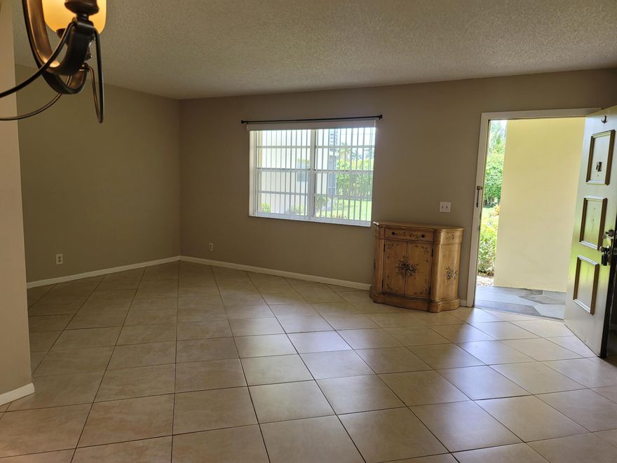 Great condo unit located in the desirable Kings Point Normandy E community 55+, just steps from the main entrance. This well-maintained unit features tile flooring throughout the entire home. The kitchen and bathrooms were upgraded a few years ago and remain in excellent condition. Everything is in perfect working order, making this condo truly move-in ready.