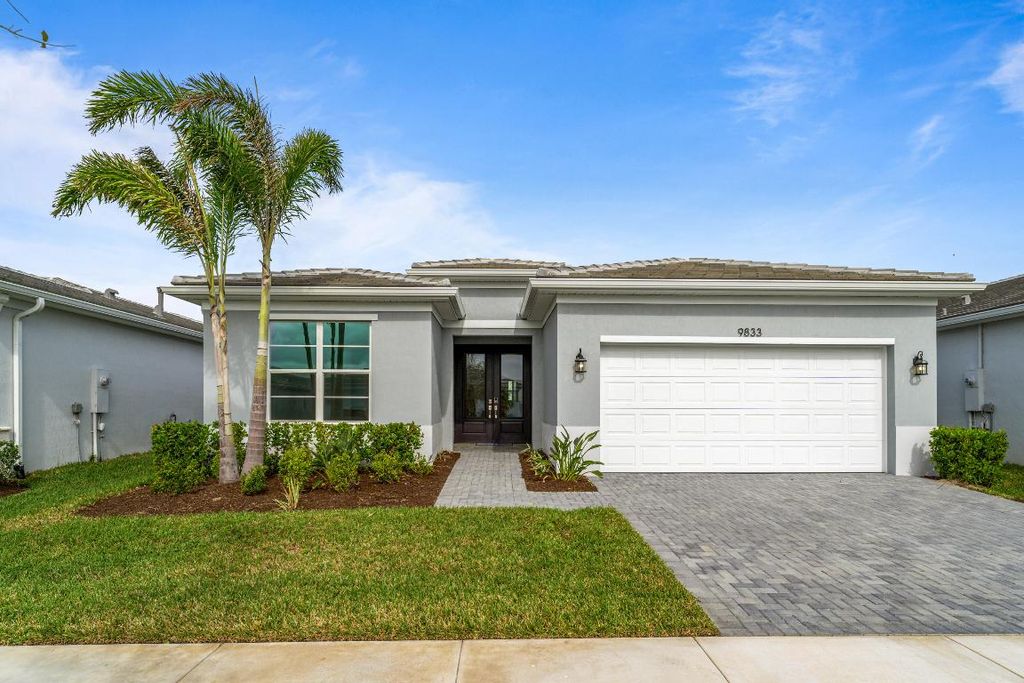 Photo of 9833 SW Isabelline Drive, Port Saint Lucie, FL 34987 (MLS # R10968893)