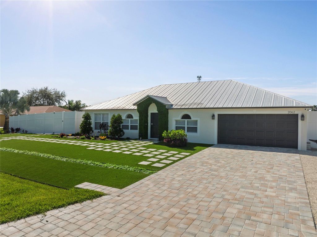 Photo of 2062 SW Larchmont Lane, Port Saint Lucie, FL 34984 (MLS # F10418870)