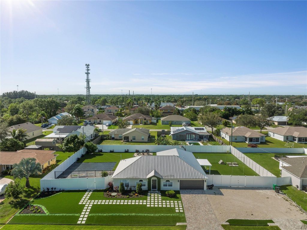 Photo of 2062 SW Larchmont Lane, Port Saint Lucie, FL 34984 (MLS # F10418870)