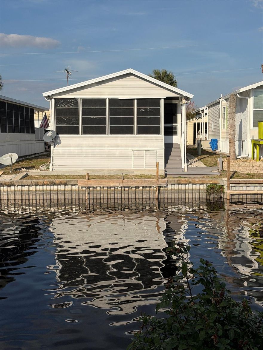 Welcome to Turtle Cove Condo Association, perfectly situated on the Rim Canal with direct access to world-famous Lake Okeechobee- a true paradise for fishing and boating enthusiasts! This well-maintained 1995 park model with added on space features 1 bed 1 bath, and is in pristine condition. The home comes furnished and offers tile flooring throughout, a durable shingle roof, and a welcoming front screened in porch- perfect for enjoying Florida's beautiful weather. The spacious enclosed Florida Room adds valuable living space, ideal for entertaining guests or relaxing after a day on the water. What truly sets this property apart is the additional lot located directly across the street, a small shed and offering the potential to build your own metal garage. Canal access with seawall.