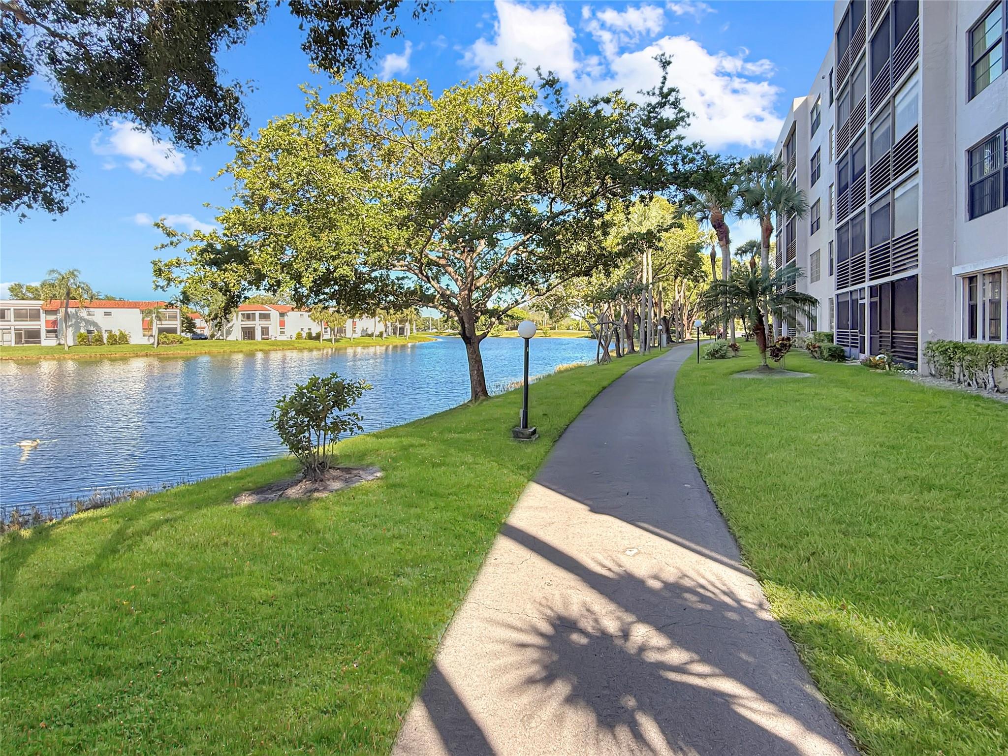 Beautifully maintained first-floor condo featuring granite countertops, new sink faucets in kitchen and baths, and in unit laundry. Enjoy a garden view front entrance and convenient access to parking via the sunroom. Private designated storage area included. Enjoy peace of mind with a 24-hour manned gatehouse and roving patrol. Colony Point has passed all inspections. Monthly maintenance covers water, sewer, cable with Showtime, and high-speed internet. Resort-style amenities include a pool with deck and tiki pavilions, lighted courts for tennis, pickleball, racquetball, and shuffleboard, 4 beach areas with BBQ grills, and a lighted path with fitness trail. Courtesy bus service available to local shopping. Experience the best of Florida living at Colony Point!