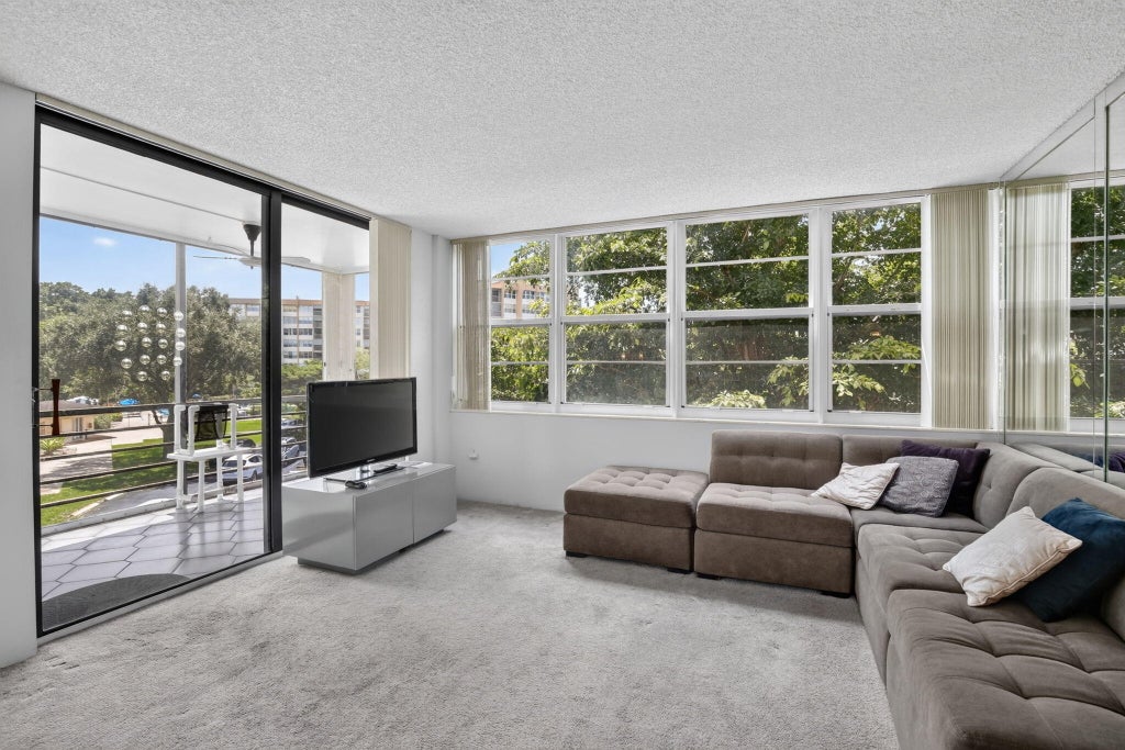 Photo of 1400 Saint Charles Place #313, Pembroke Pines, FL 33026 (MLS # B26072120)