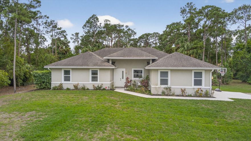 Welcome home to your quiet, peaceful oasis~ This 2019 custom-designed 4 bedroom 2 bath single family home sits on a private 1+ acre lot surrounded by mature oaks and pines. NO HOA, no rules, restrictions or covenants: do what you want on your own land. High & dry setting on a quiet dead-end street in a horse-friendly area. True four-bedroom split plan, side-entry 2-car garage, huge indoor utility room with built-in cabinetry, washer and dryer. Beautiful salt water pool & heater, sunbathing ledge & spacious covered rear porch w/ outdoor kitchen area. Upgrades include complete set of insulated impact windows, designer tile, granite countertops, all-stainless appliances, and a whole-home water softening system. Comcast alarm system. Great location minutes to schools, new shopping and parks.