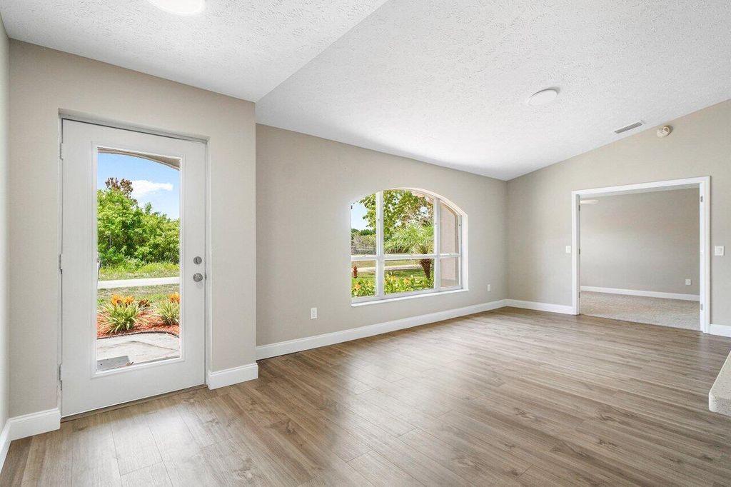 Photo of 113 SW Essex Drive, Port Saint Lucie, FL 34984 (MLS # R10993010)