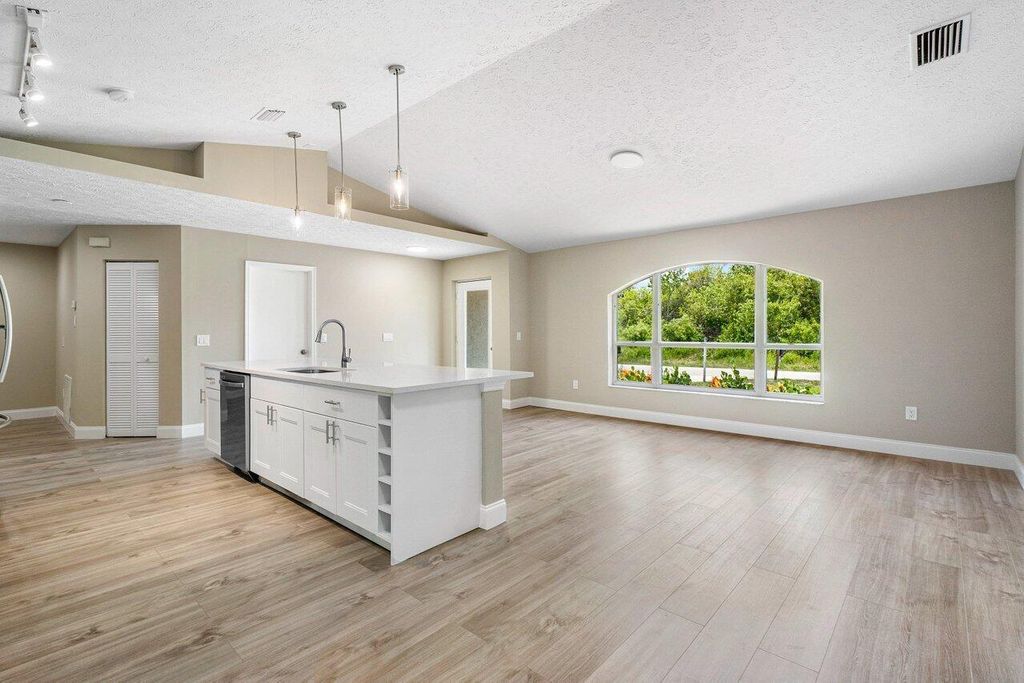 Photo of 113 SW Essex Drive, Port Saint Lucie, FL 34984 (MLS # R10993010)